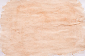 Brown splotch over white surface. Stained paper abstract art background. Spilled tea effect. Copy space.