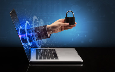 Hand with lock  coming out of a laptop with sparkling effects
