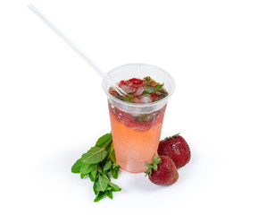 Cold mint drink with fresh strawberry, mint twigs, whole berries