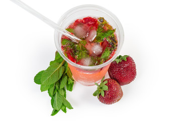 Top view cold mint drink with strawberry, mint twigs, berries