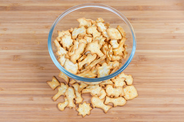 Top view of salty crackers various forms in glass bowl