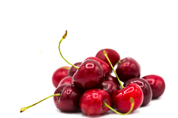 Obraz na płótnie Canvas fresh ripe sweet cherries in drops of dew isolated on white background 