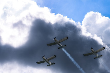 Airplanes on airshow. Aerobatic team performs flight at air show in Krakow, Poland.