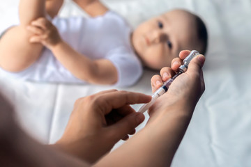 Obraz na płótnie Canvas Doctor vaccinating a newborn baby boy. Child's Immunization, Children's Vaccination, Health concept.
