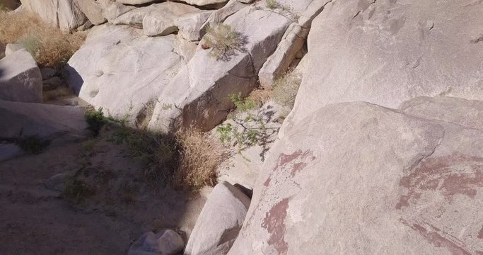 Top down view of rocks and boulders with historic pictographs by Native Americans at Coyote Hole in Joshua Tree National Park, California
