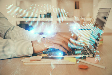 Social network theme hologram with businessman working on computer on background. Concept of world...