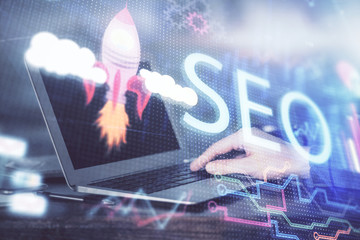 Double exposure of seo icon with man working on computer on background. Concept of search engine...