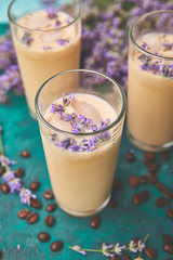 Summer drink iced coffee with lavender in glass