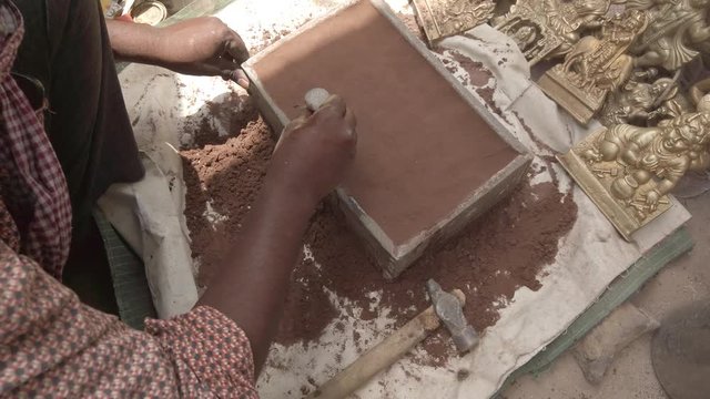 Indian mythological Gods and Goddesses metal figurines being manufactured in recycled metal before the arrival of major Hindu festivals and celebrations across India 4k slow-motion handheld stabilized