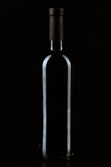 Wine bottle on a dark black background