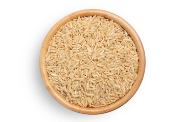 raw brown rice heap in wooden bowl top view surface isolated on white background