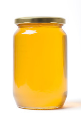 Herbal Honey in a Jar on White