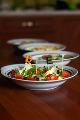 Several salads with vegetables and greens. Healthy food concept. Mixed vegetables