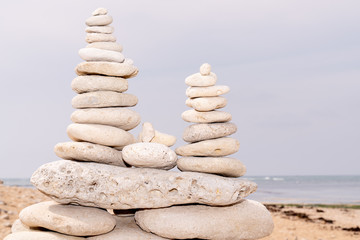 Fototapeta na wymiar Spa stones balance on beach in Ile de Re France