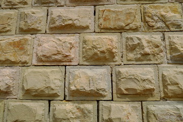 Détail de mur de pierre ancien avec pierres taillées à bords lisses