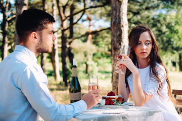 Couple of lovers celebrating their engagement at the dinner table