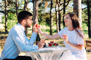 Couple of lovers celebrating their engagement at the dinner table