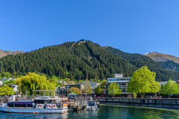 Fototapeta premium QUEENSTOWN, NEW ZEALAND - OCTOBER 10, 2018: View of the city embankment. Copy space for text.