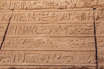 Fototapeta na wymiar Columns with hieroglyphs in Karnak Temple at Luxor, Egypt. travel