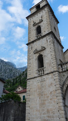 Fototapeta na wymiar Old church inside Stari Grad, Kotor, Montenegro. Kotor bay and Old Town from Lovcen Mountain. Montenegro. Tower with mountains in the background