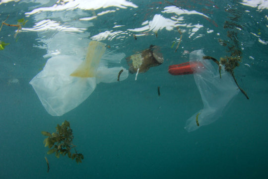 Plastic ocean pollution. Plastic bags, bottles and other trash dumped in sea 