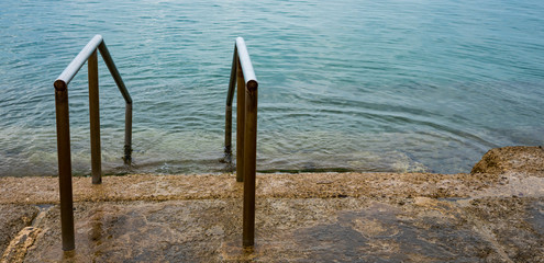 Fototapeta premium metal stairs in the Adriatic sea, Opatija, Croatia