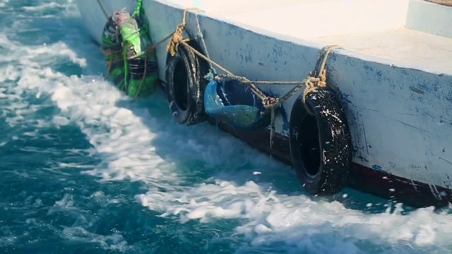 a boat that swings on the waves and rushes forward