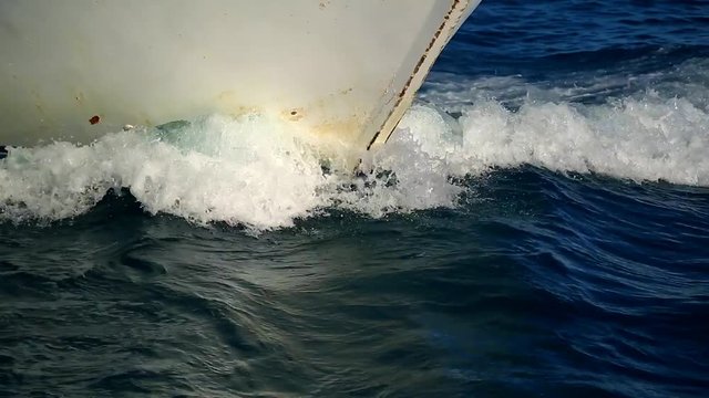Ship splits the waves in its path