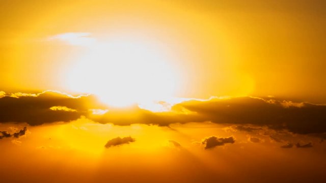 Morning sun over the city passes through the clouds