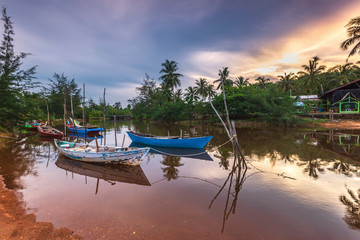 Naklejka na ściany i meble The Couple Traditional boat at bintan island Indonesia