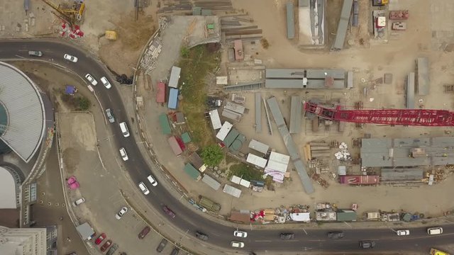 Construction of a new road junction in the city. Aerial view. The construction of the overpass over the highway. Transportation in city traffic