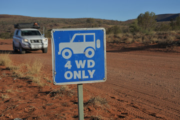 Four wheel drive vehicle driving on a 4 WD only road during a road trip in central Australia red center outback © Rafael Ben-Ari