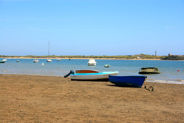 Fototapeta na wymiar Boat an ships in a spanish beach El Rompido Huelva