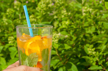 Orange lemonader with mint leaves