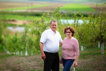 Senior couple outdoor in orchard