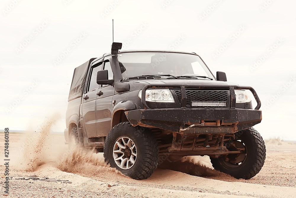 Wall mural suv in the desert / old vintage all-terrain vehicle, expedition in the desert on the sand, extreme c