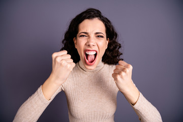 Close up photo beautiful amazing wild she her lady yelling loud not fair situation roar hands arms fists raised forward I would kill you face wear casual pastel pullover isolated grey background
