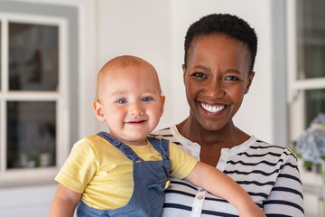 African nanny with baby boy - obrazy, fototapety, plakaty