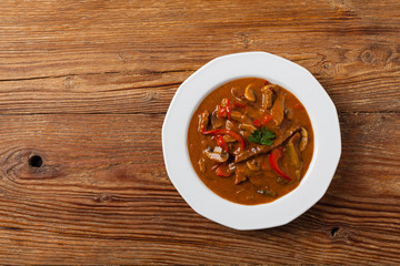 Boeuf, Stroganow, Strogonow. Classic, Russian beef stew. Served on a white plate. Top view. Natural background.
