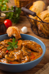 Boeuf, Stroganow, Strogonow. Classic, Russian beef stew.  Served in a blue bowl. Front view....