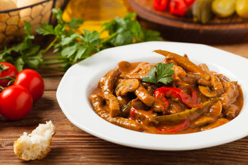 Boeuf, Stroganow, Strogonow. Classic, Russian beef stew. Served on a white plate. Front view. Natural background.