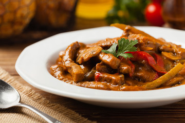 Boeuf, Stroganow, Strogonow. Classic, Russian beef stew. Served on a white plate. Front view. Natural background.