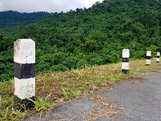 A milestone beside the road to the dam, Khun Dan Prakan Chon Dam, Nakhon Nayok, Thailand