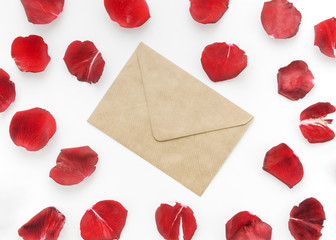 Petals of red roses with letter