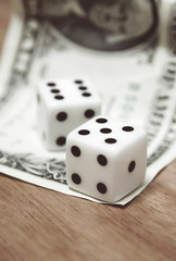 dice and dollar note