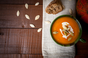 Pumpkin soup on wooden