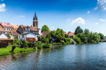 Naklejka premium View of Telc across pond with reflections, Unesco world heritage site, South Moravia, Czech Republic.