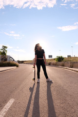 portrait of a teenager skater girl at the city