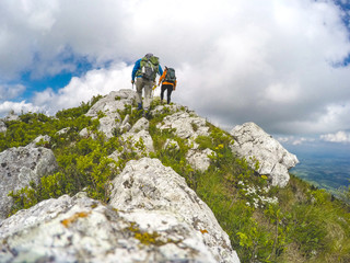 Couple of hikers hiking on a sunny day	