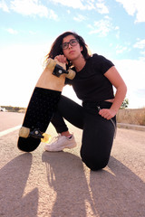 portrait of a teenager skater girl at the city